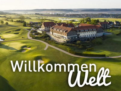Willkommen Welt im Weimarer Land - das Spa & GolfResort Eine Luftperspektive vom Spa & GolfResort Weimarer Land in Abendstimmung mit dem Schriftzug: Willkommen Welt